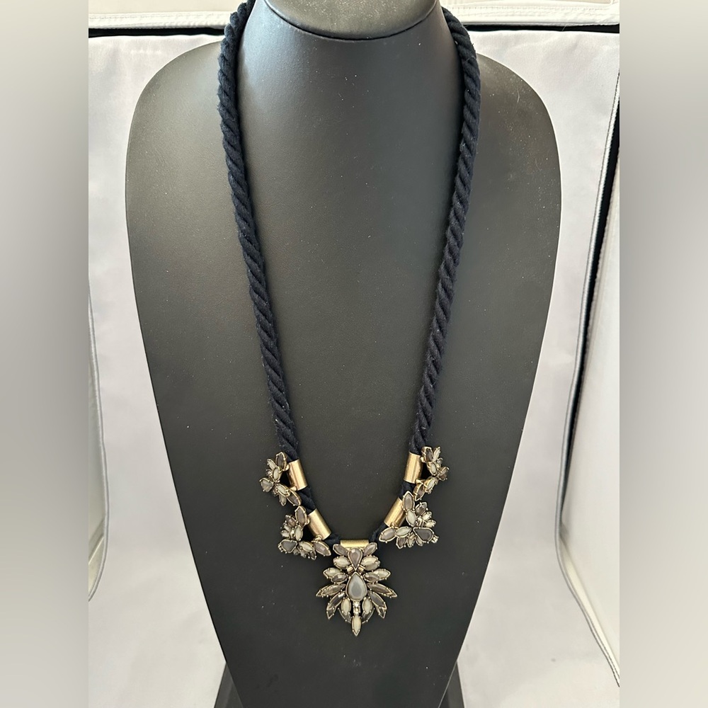 Loft necklace with shades of gray rhinestones in gold tone on thick black cord